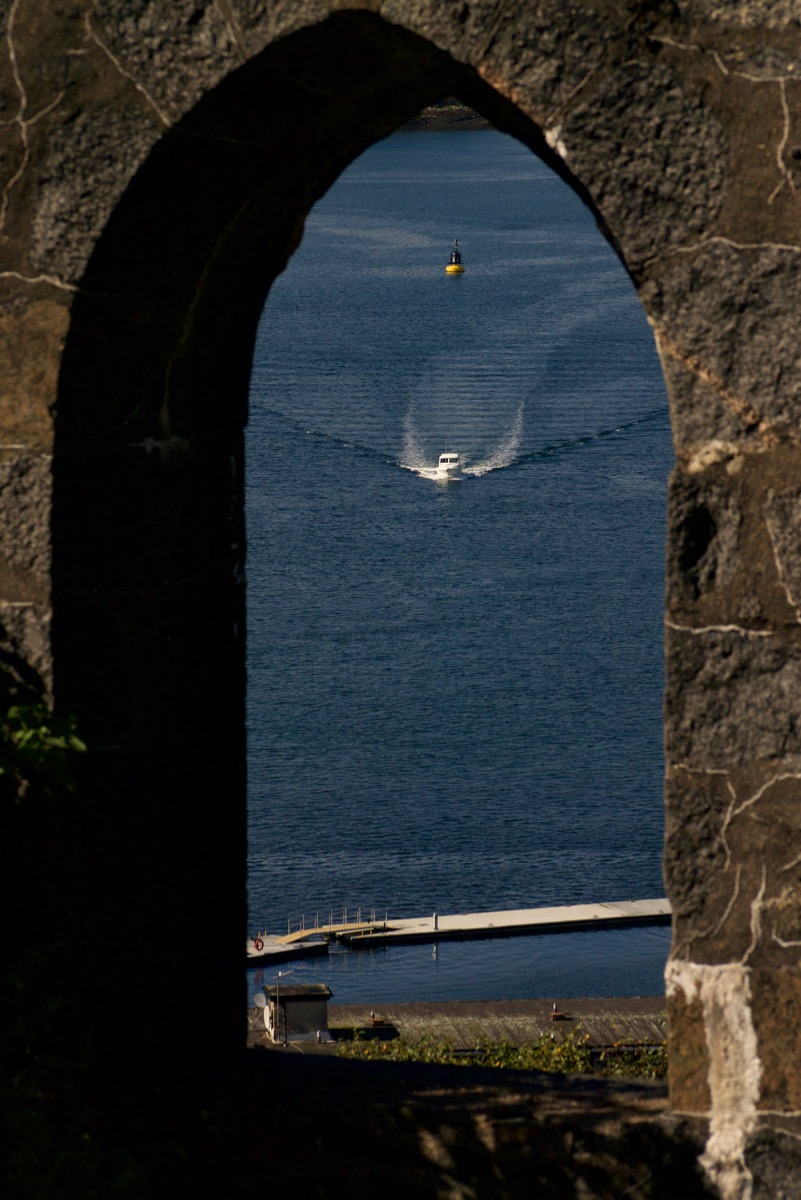 Boat in an arch of McCaig's Tower, Oban, Scotland